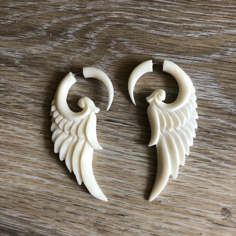 Gorgeous faux gauge wing bone carved earrings